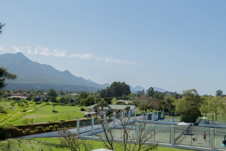 Outdoor tennis courts enjoy mountain views at Fancourt Resort