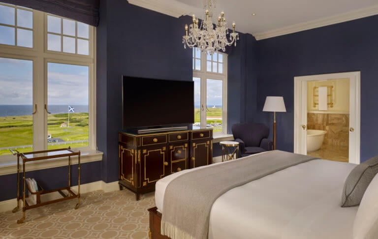 Luxuriously appointed bedroom overlooks the Trump Turnberry Resoort