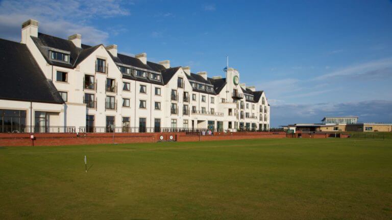 Long view of Carnoustie Hotel's exterior on a sunny day