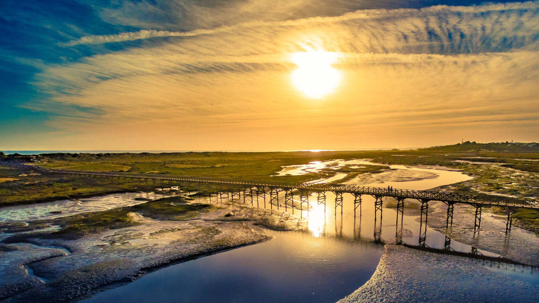 Sunrise over a bridge connecting Quinta do Lago resort to a beach
