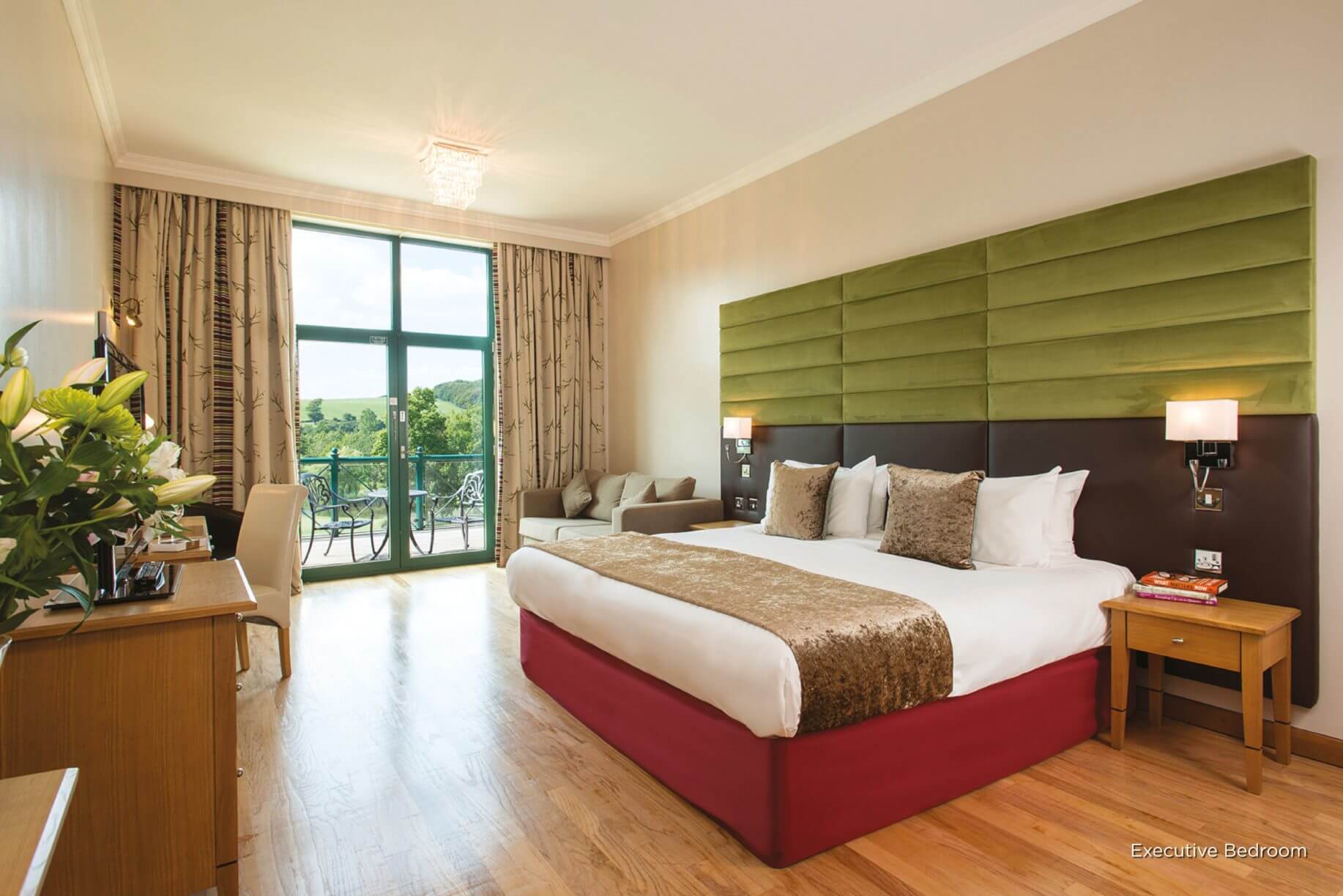 Large king bed with hardwood floor