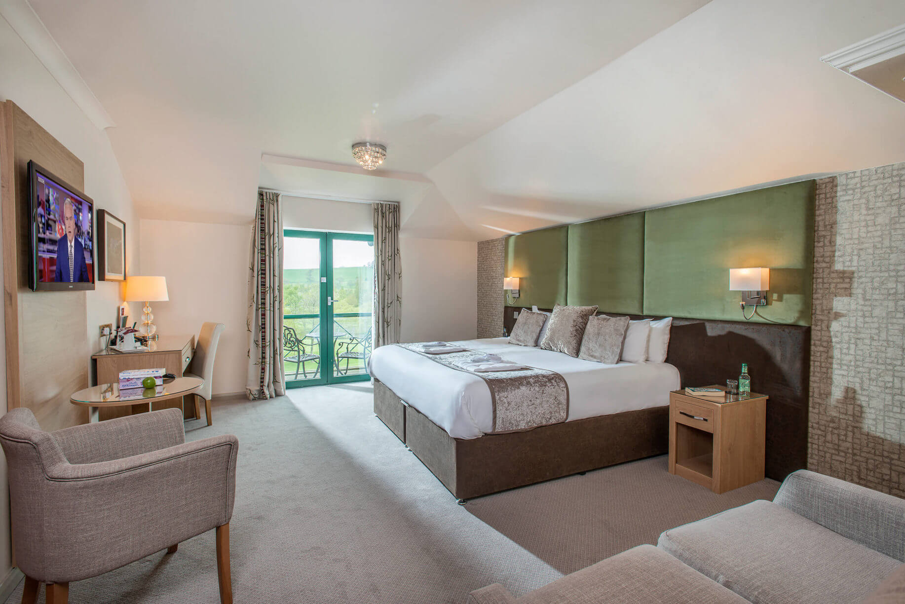 Large king bed with contemporary furniture at Vale Resort