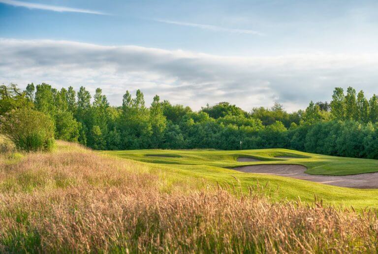 Long grass flanks a fairway at Vale Resort
