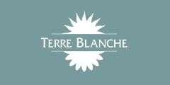 White Terre Blanche Logo on blue background