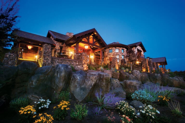 Pronghorn Resort clubhouse lit up at twilight in Oregon