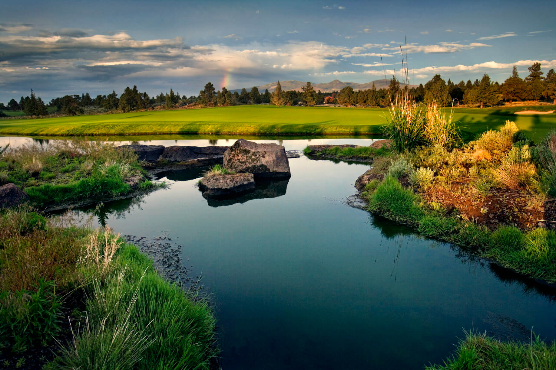 A lake stands on the Nicklaus course at Pronghorn Resort