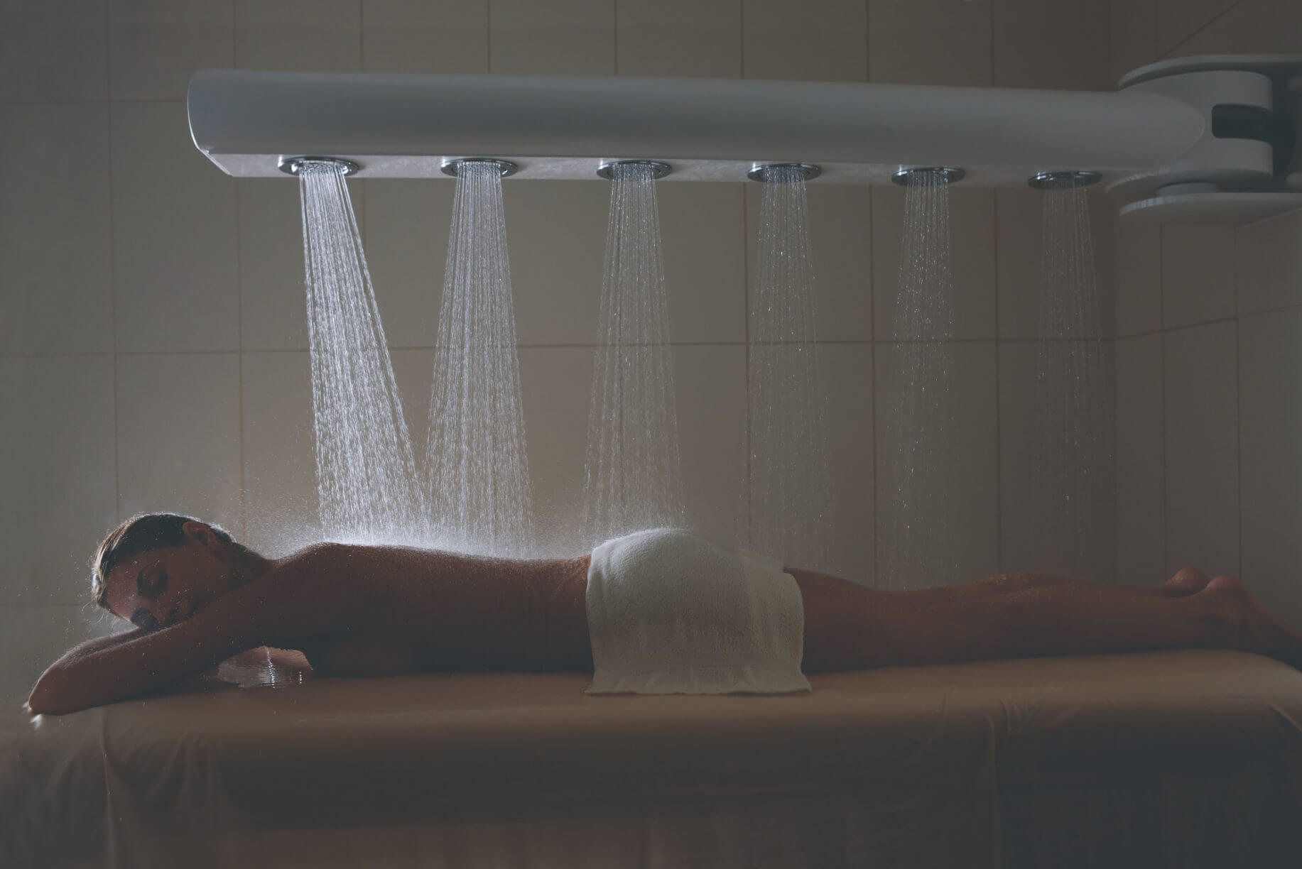 Lady enjoys indoor spa treatment at Kohler Spa