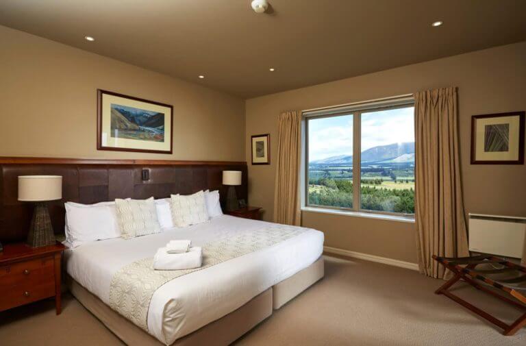 Large bedroom with golf course and Mt Hutt views