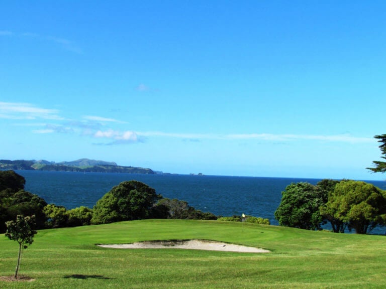 Par-three golf hole overlooks the Bay of Islands in New Zealand