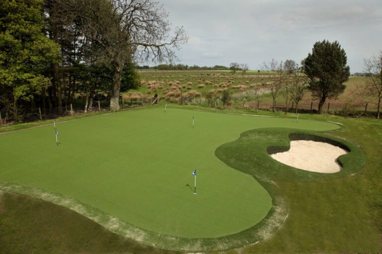 Practice putting green and bunker at Hawkswood Country Estate