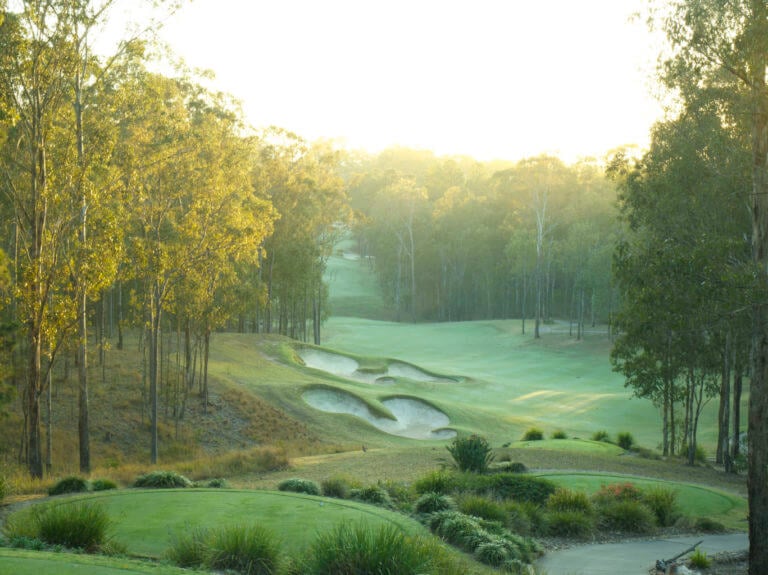 Sunlight shines on narrow fourth hole at Brookwater golf club