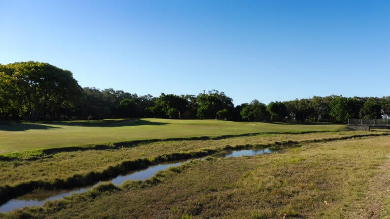 Natural waterway meanders through golf hole at Royal Queensland golf course