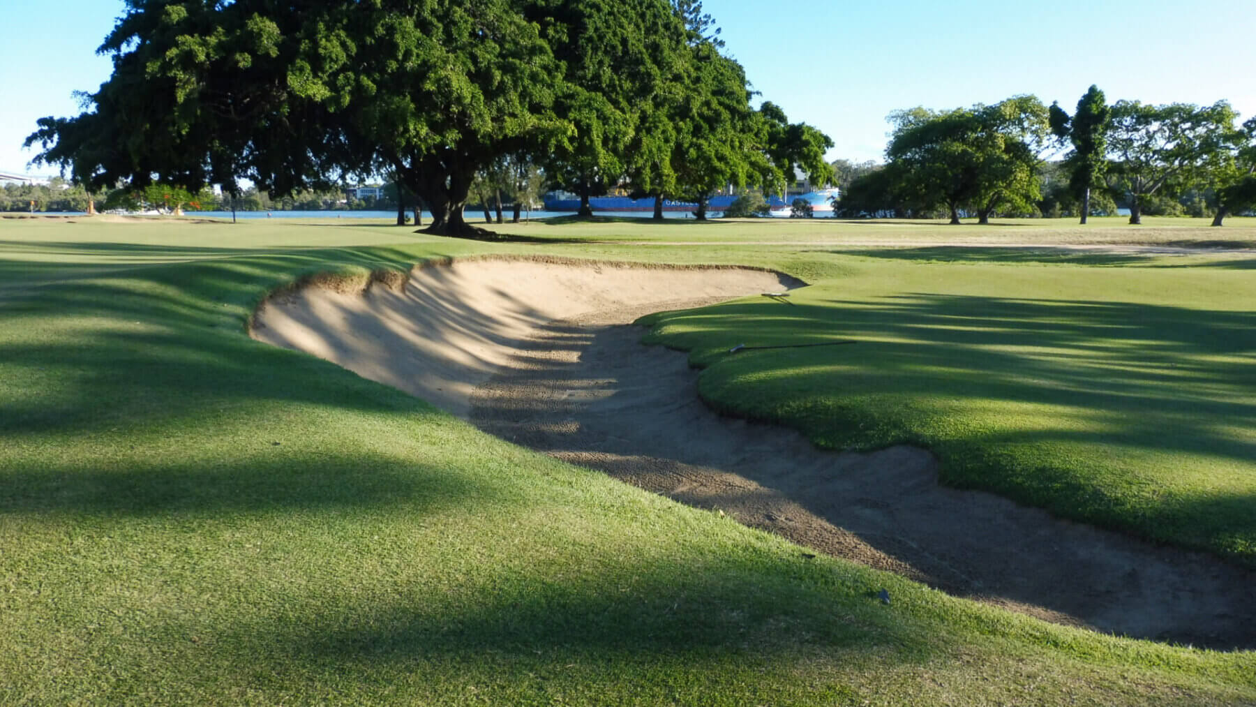 Large bunker frames the tenth green at Royal Queensland