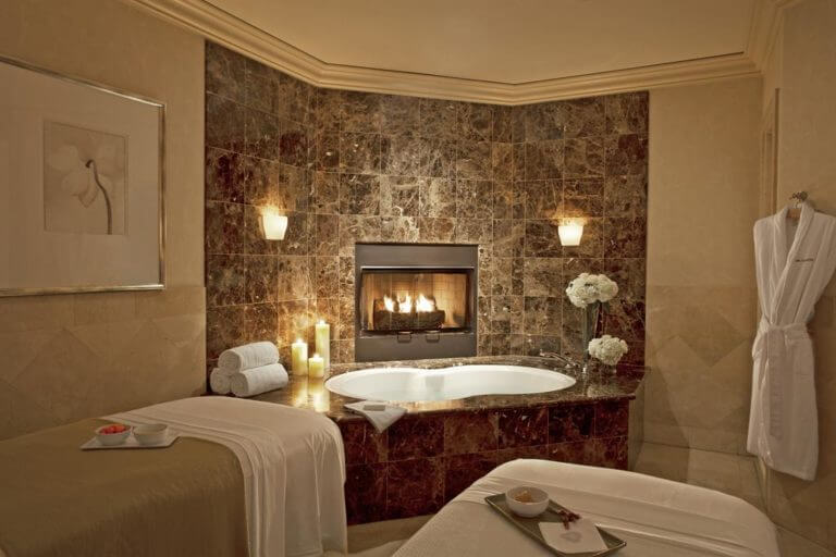 Luxurious spa treatment room with fireplace