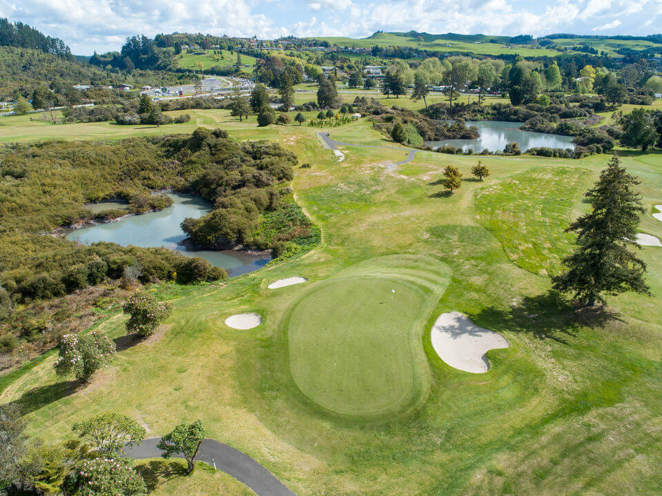 Ninth hole surrounded by bunkers and trees
