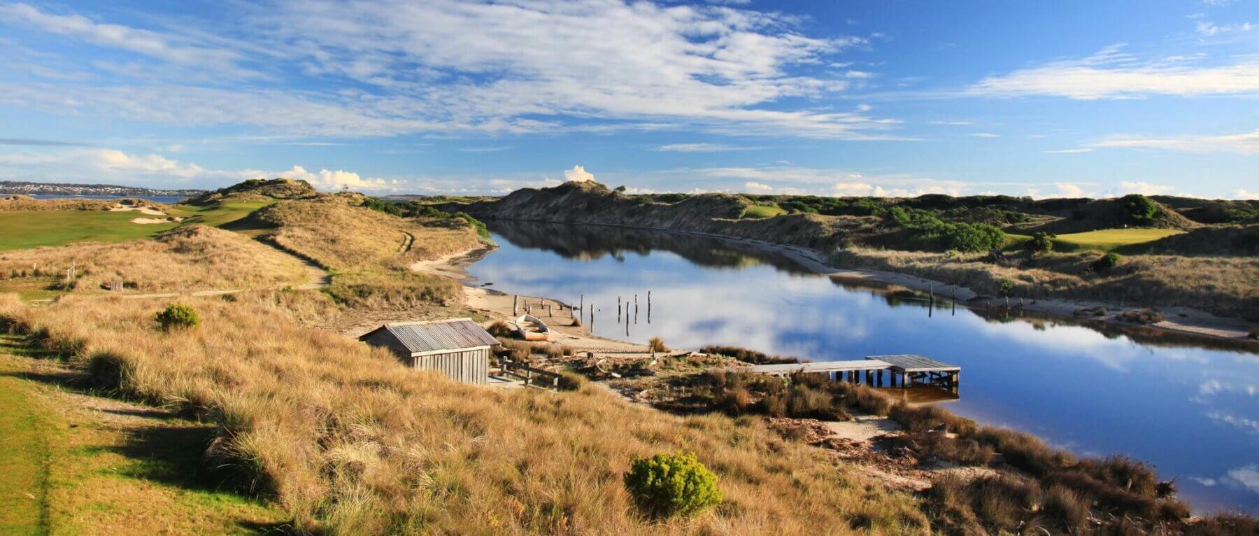 Pristine lake and lakehouse on Barnbougle Dunes golf course