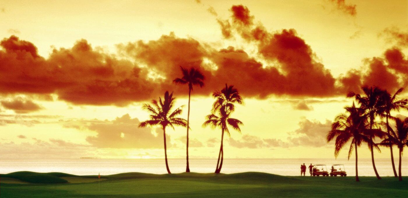 Sunset casting golden light over Denarau golf course