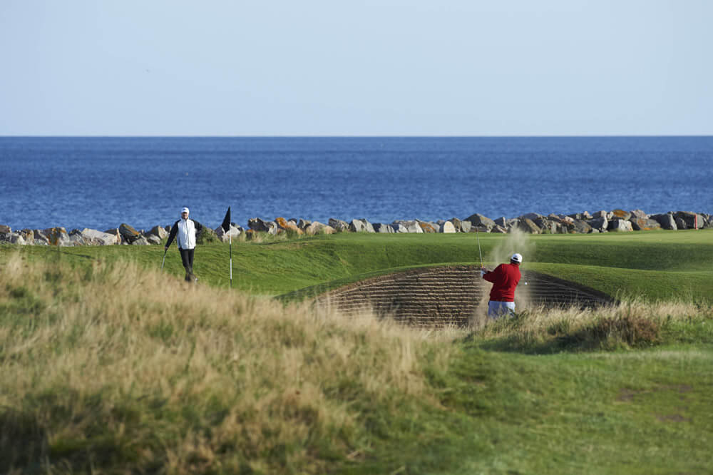 Golfers on the fourth green at Nairn Golf Club