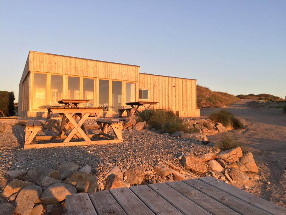 Ocean Dunes golf clubhouse at sunset