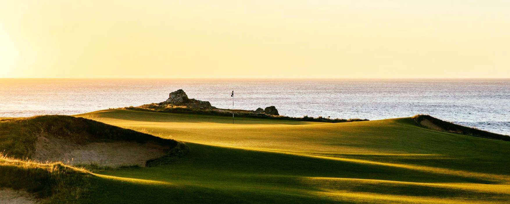 Ocean dunes golf hole framed by the sea