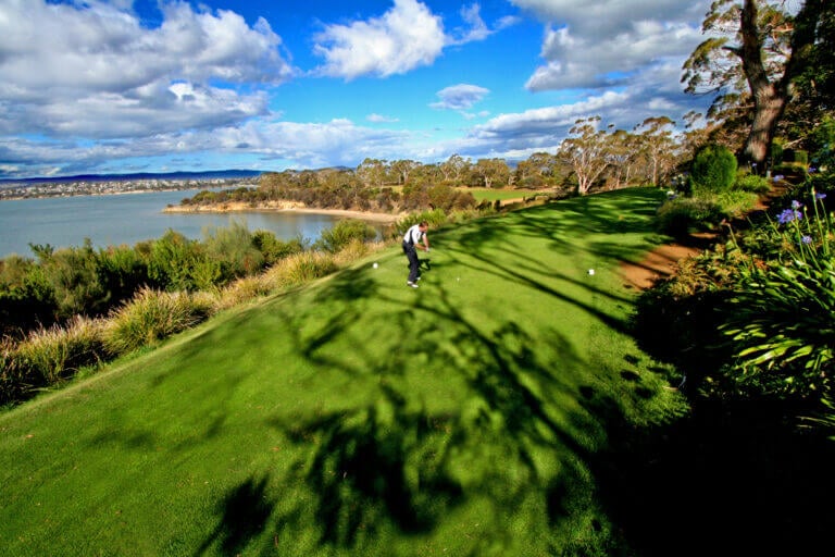 Golfer teeing off at Tasmania Golf course