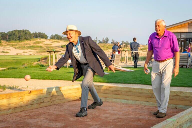 Partygoers play bocce at Sand Valley