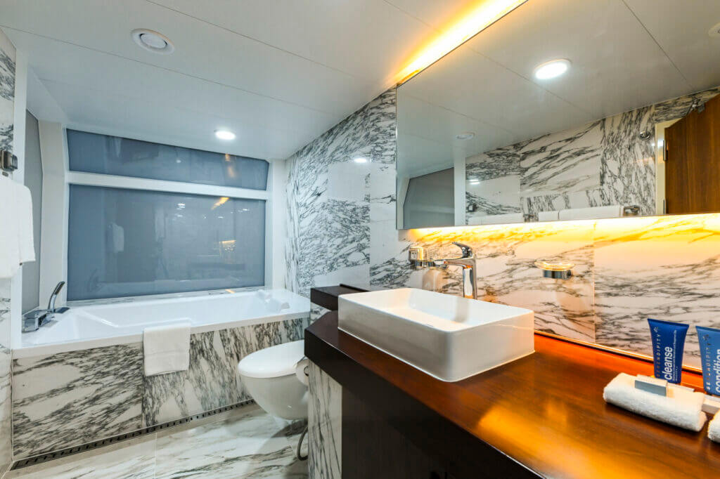 Bridge Deck Suite bath on the Coral Geographer cruise ship