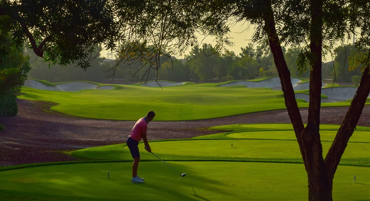 Golfer tees off on The Earth Course