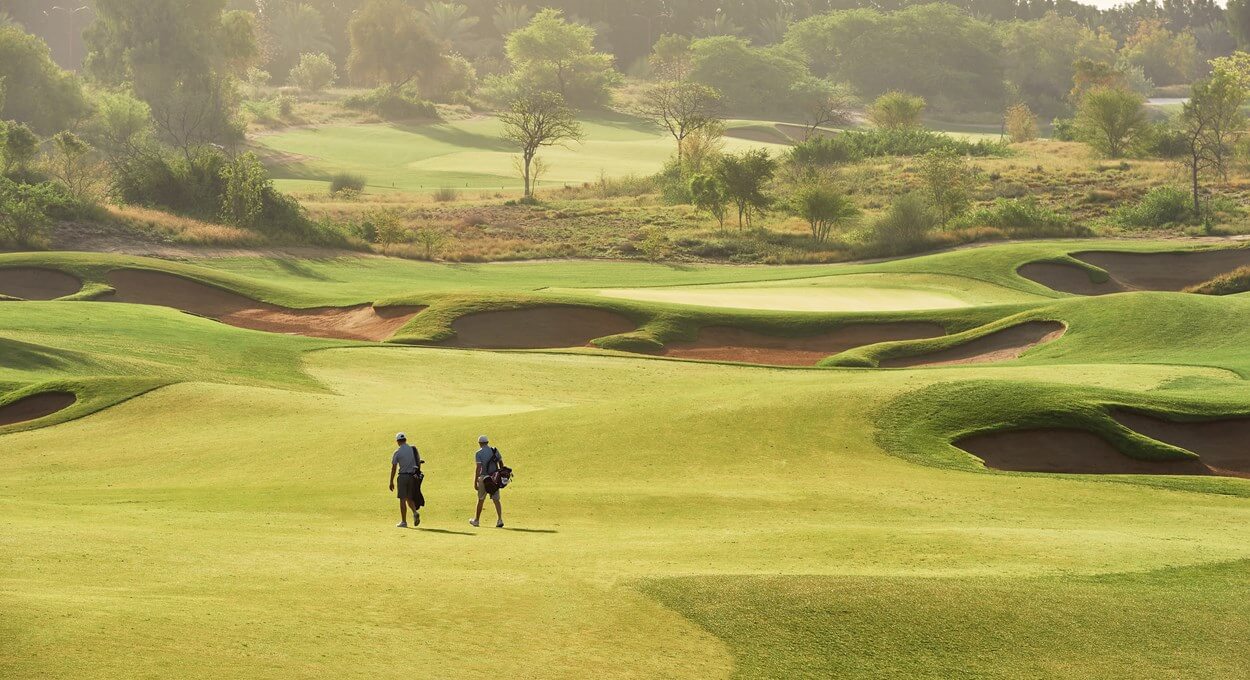 Golfers play the Fire Course at Jumeirah Golf Estates