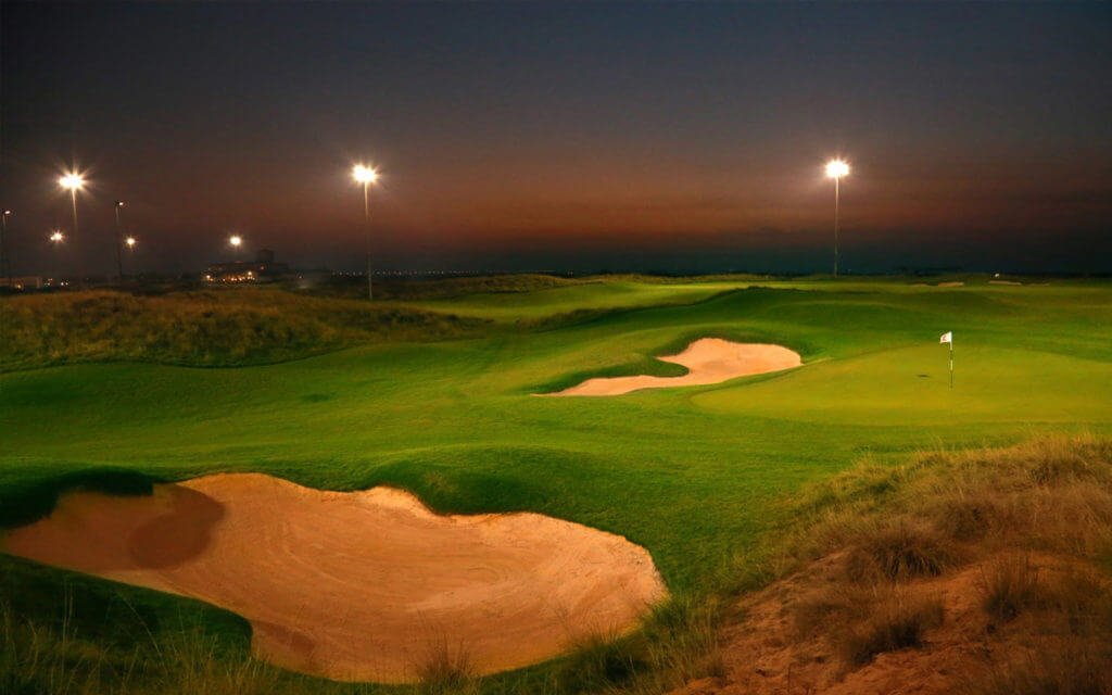 Yas Links golf course under floodlights