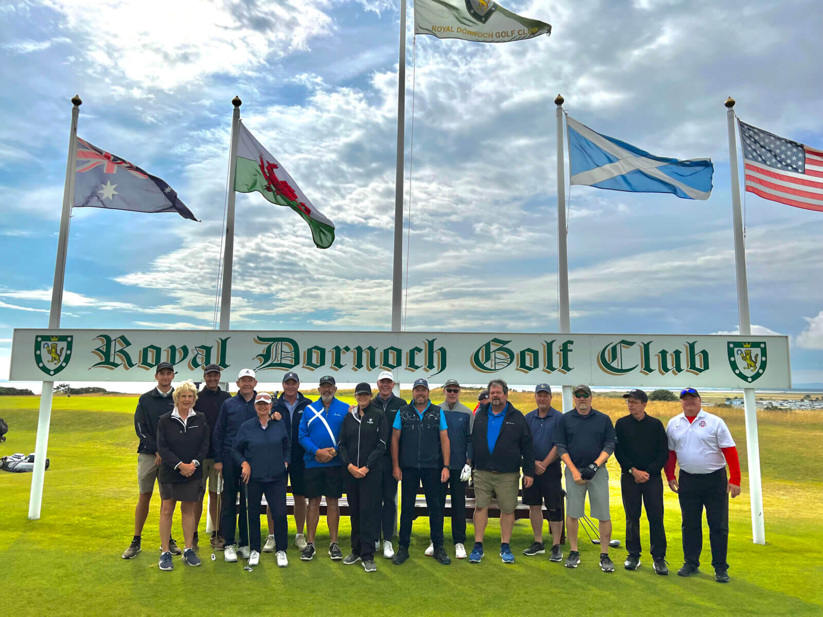 Tour group stands in front of golf course