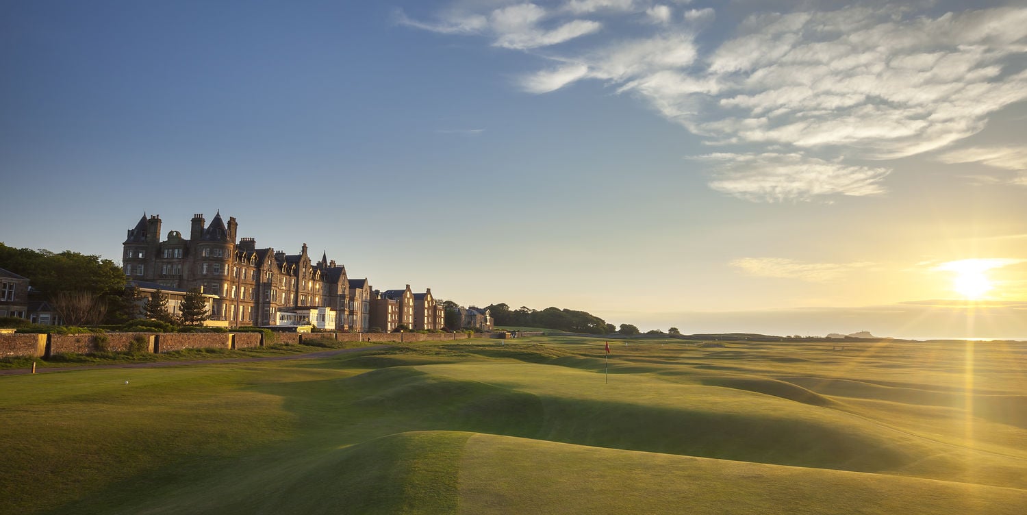 The sun sets on the 18th hole and clubhouse at North Berwick - West Links, Scotland, United Kingdom