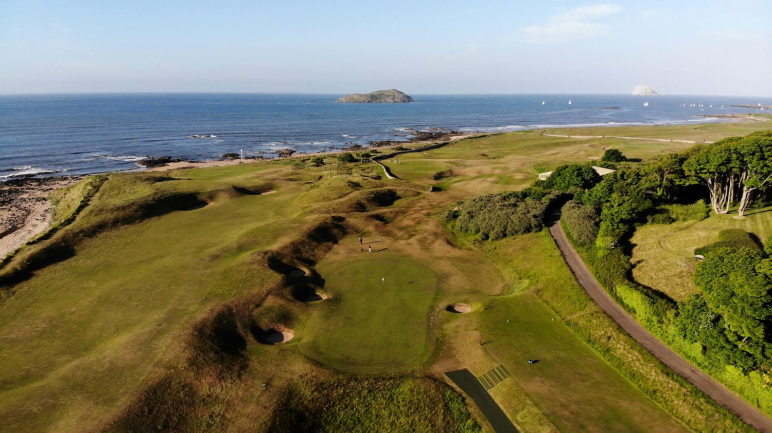 Flyover displaying West Links holes and The North Sea at North Berwick Golf Club, Scotland, United Kingdom