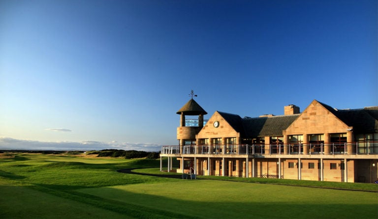 The sun bathes St Andrews Links Clubhouse in golden light, Scotland