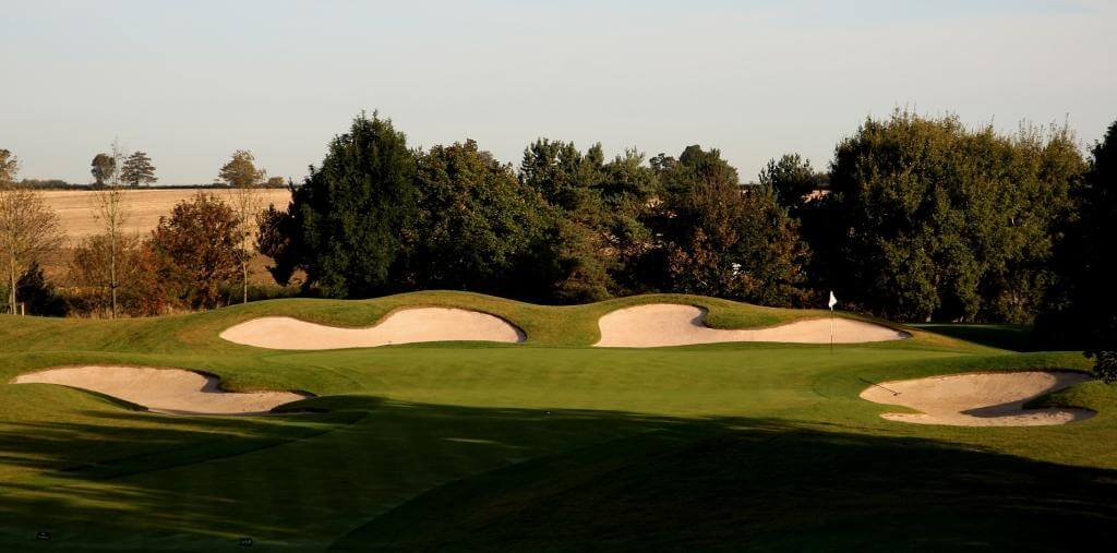 Displaying a green surrounded by bunkers on the PGA National Course, The Belfry Resort, England, United Kingdom