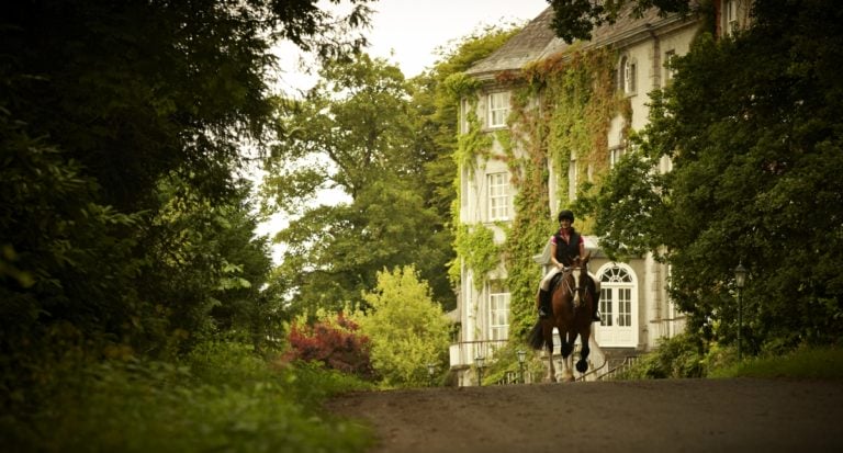 Displaying a horse and rider in front of Mount Juliet Estate, Kilkenny, Ireland