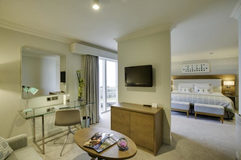 Displaying the speratre living area and bedroom in a junior suite, Portmarnock Resort, Dublin, Ireland