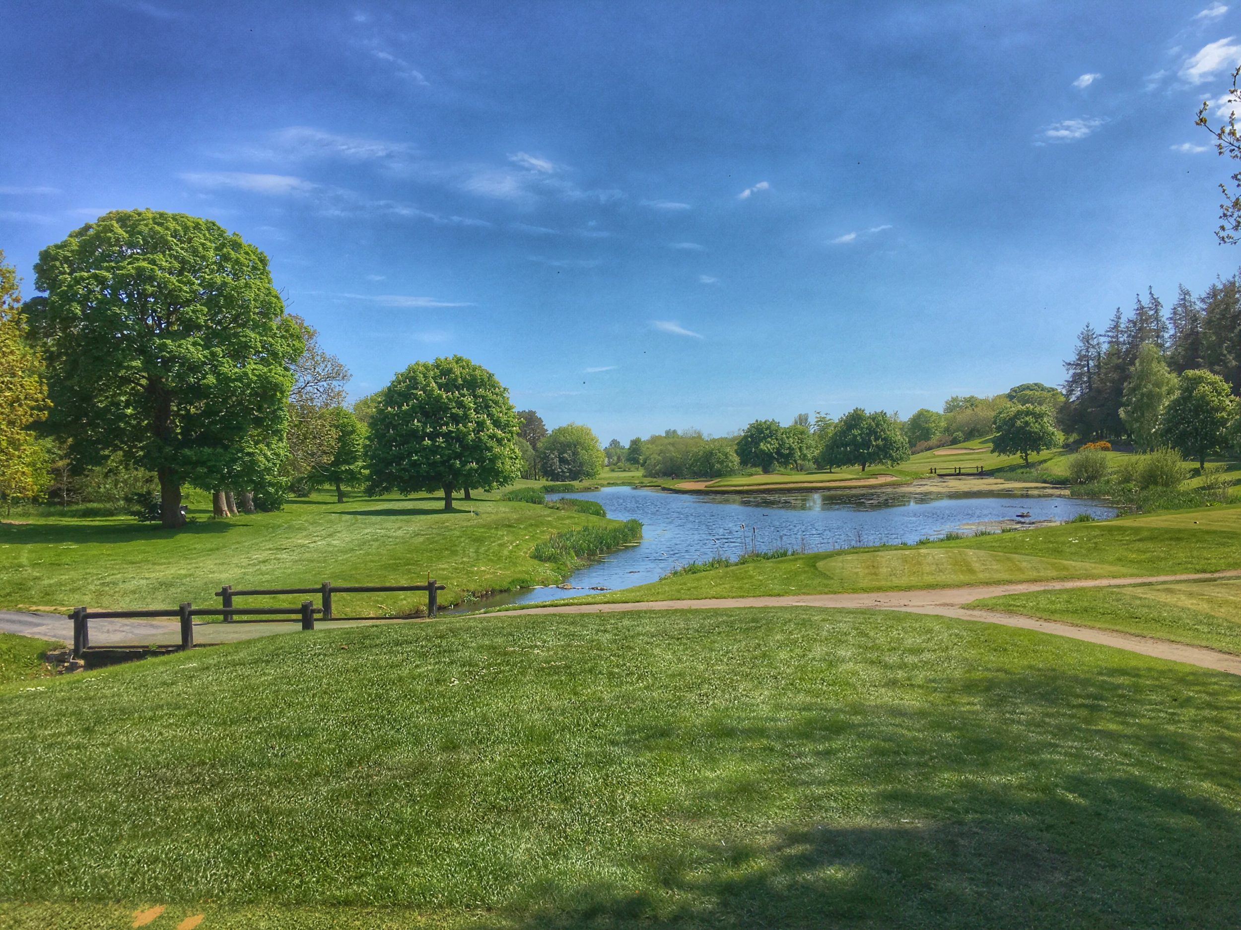Lush green grass and water line the courses at Druids Glen Golf Resort, Wicklow, Ireland