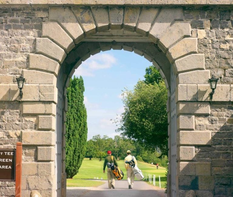 A dramatic archway stands over the entrance to golf, Carton House, Ireland