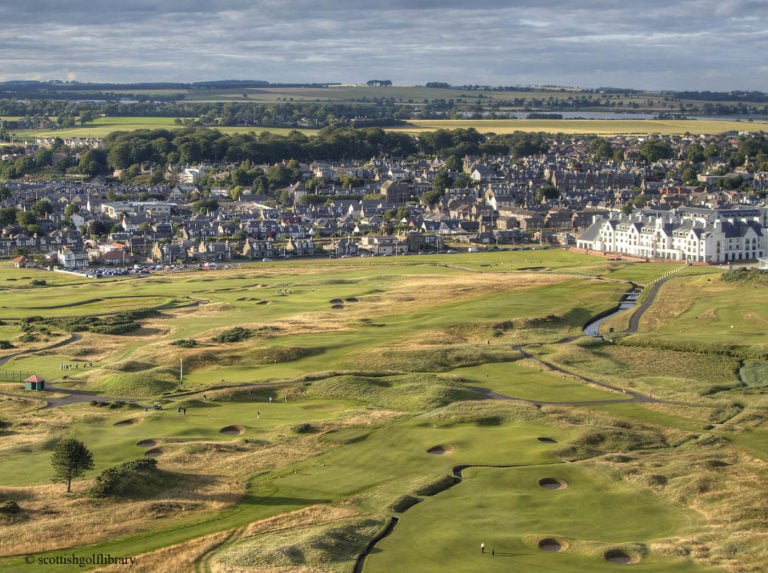 Aerial view of the town contrasted with Carnoustie Golf Links, Scotland, United Kingdom