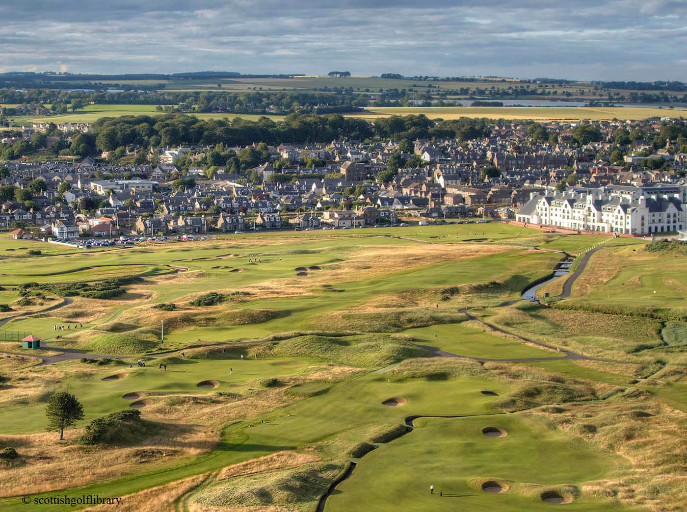 Aerial view of the town contrasted with Carnoustie Golf Links, Scotland, United Kingdom