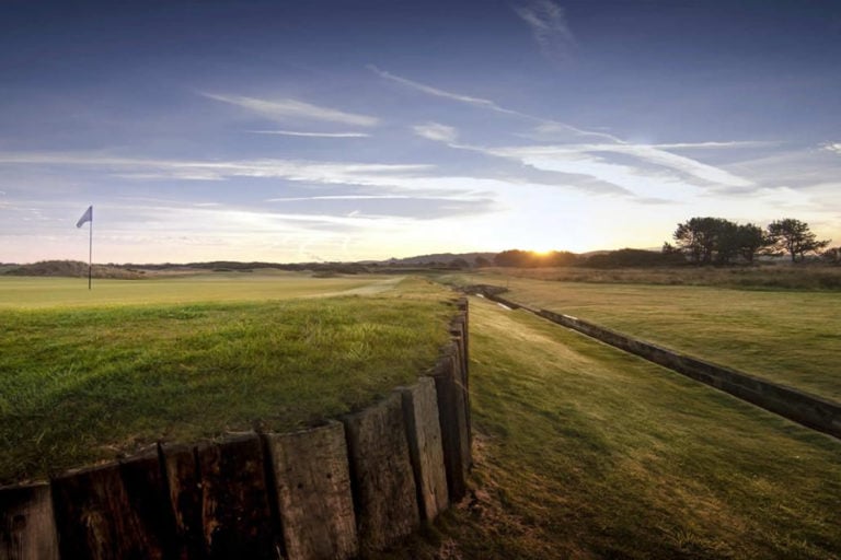 View of a raised green running parallel to a trench at Kilmarnock Barrassie Links, Troon, Scotland, United Kingdom
