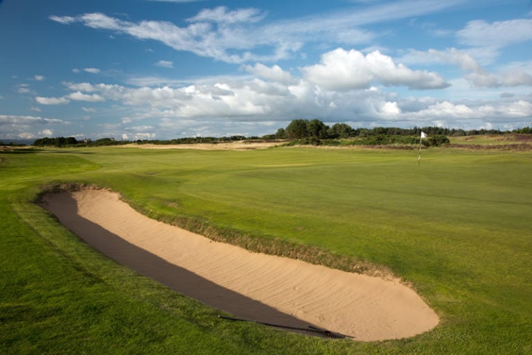A long bunker straddles the green on the 8th at Gailes Links, Ayrshire, Scotland, United Kingdom