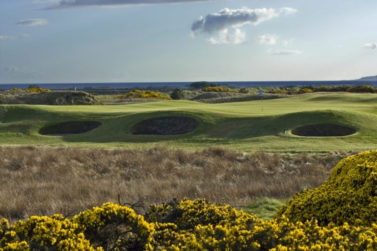 3 pot bunkers sit side-by-side on the 3rd hole at Dundonald Links, Scotland, United Kingdom