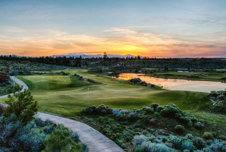 Image displaying the setting sun over the golf course at Tetherow Resort, Bend, Oregon, USA