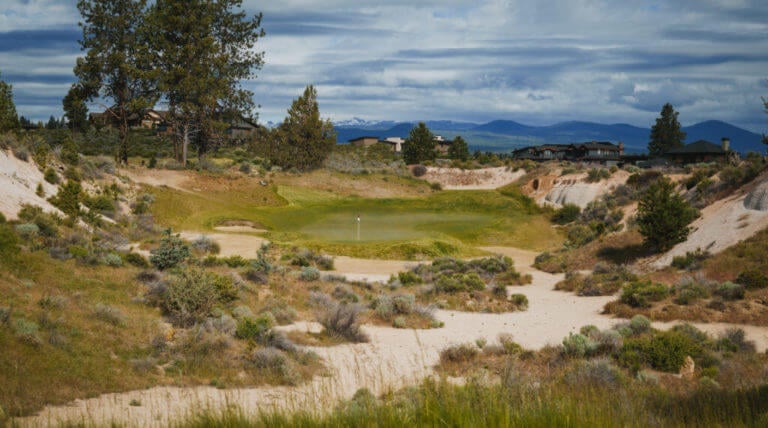 Image of an island green in the desert style links course at Tetherow Resort, Bend, Oregon, USA