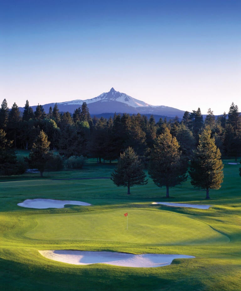 Aerial image of Mt Washington and in the foreground lies a Green on the Glaze Meadow Golf Course, Black Butte Ranch, Oregon, USA