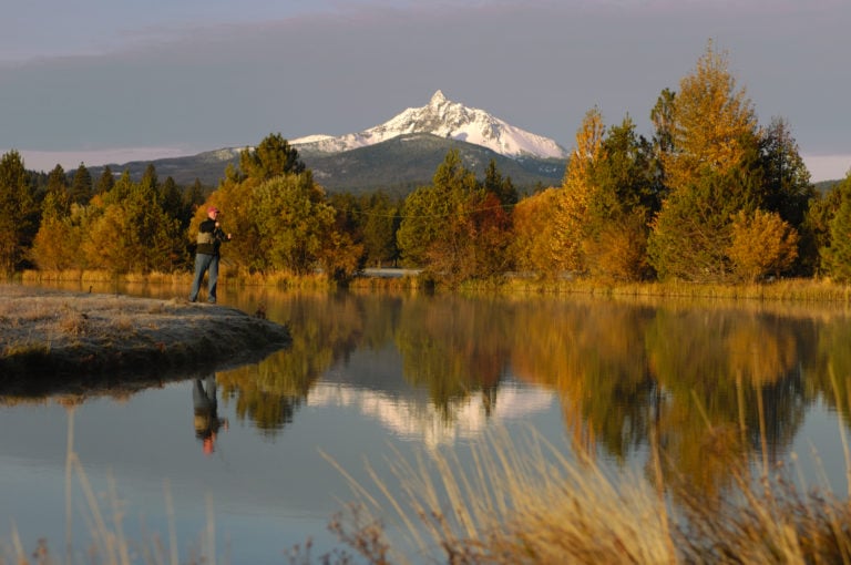 Image depicting a man fly fishing at Black Butte Ranch, Oregon, USA