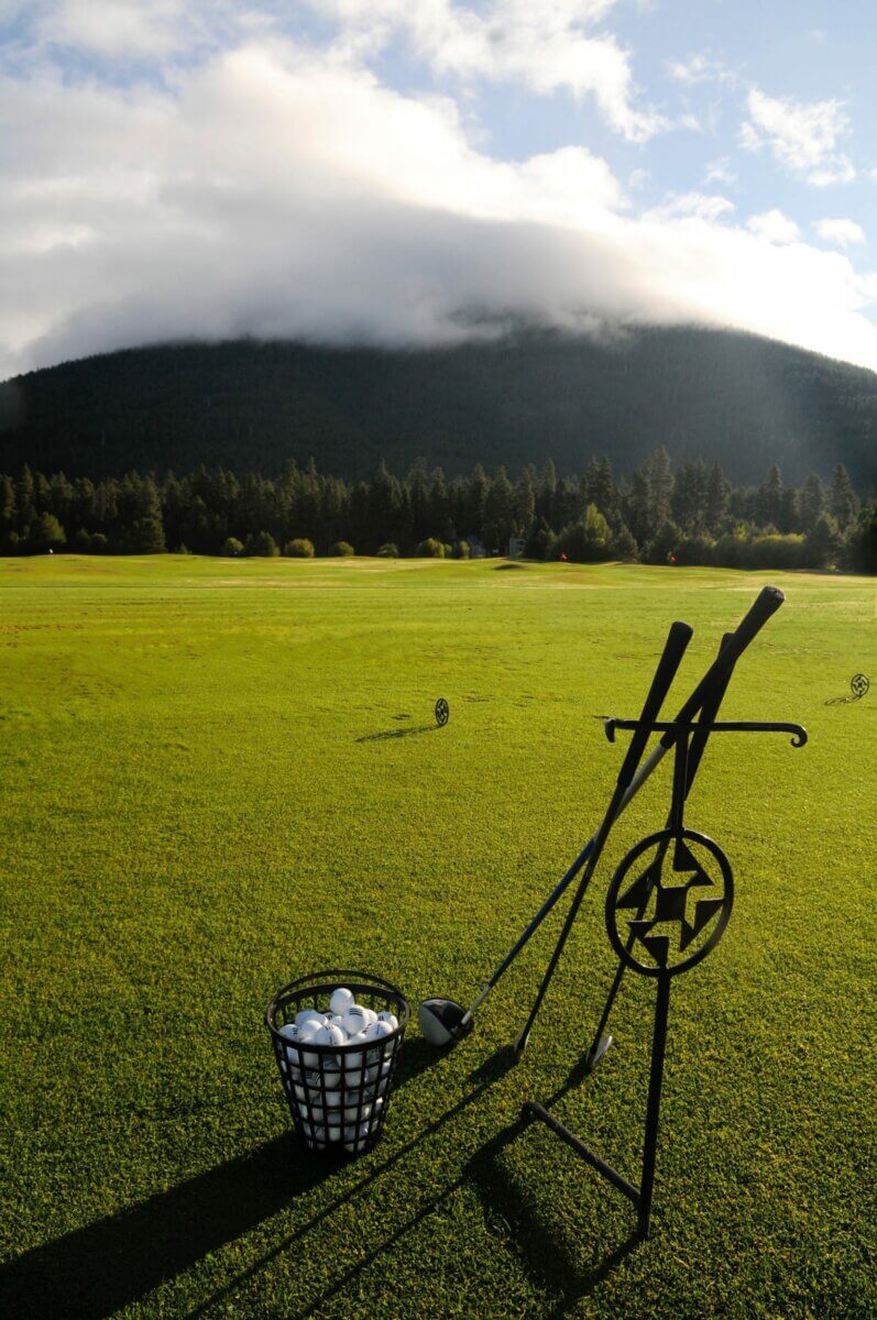 Image depicting the driving range and Mt Jefferson covered in cloud, Black Butte Ranch, Oregon, USA