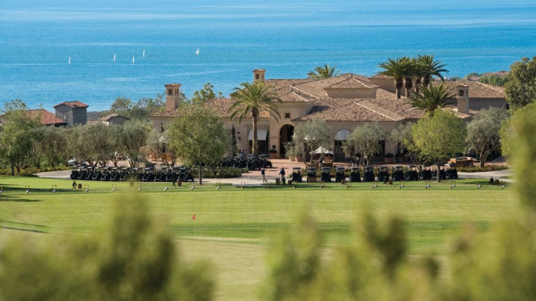 Image of a driving range and clubhouse at Pelican Hill Resort, Newport, California, USA